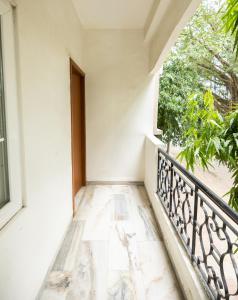 a balcony of a house with a window at Ishan Apartments 3BHK in Vadodara