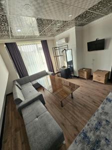 a living room with a couch and a coffee table at biglife hotel in Istanbul