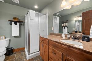 a bathroom with a sink and a shower and a toilet at Stones Throw in Hill City +44 photos