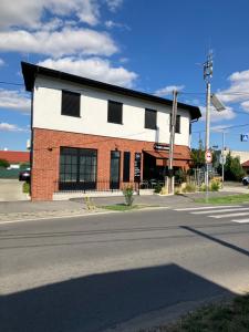 a building on the corner of a street at Ivanka Apartments in Ivanka pri Dunaji