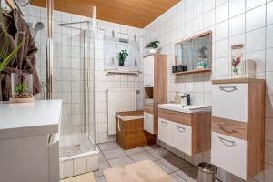 a bathroom with a shower and a sink at Kastanie in Selb +12 photos