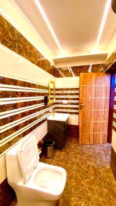 a bathroom with a toilet and a sink at The Mountain Vault in Barog +50 photos