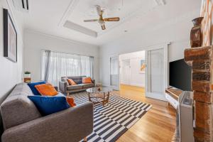 a living room with a couch and a ceiling fan at Brighton Belle Stawell in Stawell