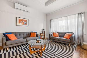 a living room with two couches and a coffee table at Brighton Belle Stawell in Stawell