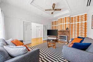 a living room with two couches and a fireplace at Brighton Belle Stawell in Stawell
