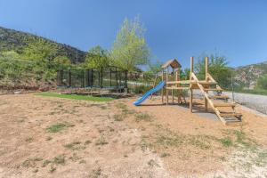 a playground with a slide in a field at Móvil Home Grande in Alós de Balaguer
