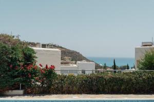a view of the ocean from a resort at 3BR Panoramic Sea View Villa with Private Pool by Cyprus Horizons in Pissouri +34 photos