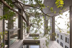 an external view of a building with a tree at Long Weekend Haus in Seoul