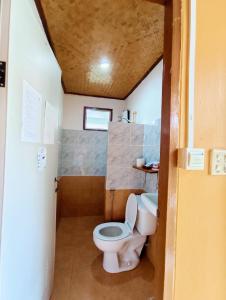 a small bathroom with a toilet and a sink at The Countryside Pai in Pai +49 photos