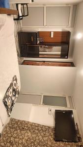 a small kitchen with a microwave in a room at Riverside Bliss Villa in Kallar-Bridge