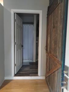 a door leading into a room with a hallway at Cozy Private Studio in Des Moines