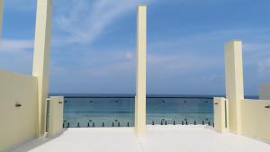 a view of the ocean from the balcony of a building at The Oceanview Grand at Hulumale and Male in Hulhumale