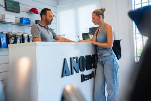a man and a woman standing at a counter at Añoreta Suites in Rincón de la Victoria +58 photos