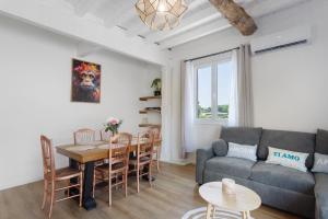 a living room with a couch and a table at Maison Mendi Borda Pays Basque in Larribar-Sorhapuru