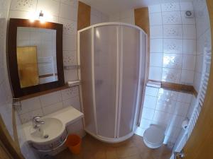 a bathroom with a shower and a sink at Apartments Car in Rab +30 photos