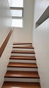 a staircase in a house with a window at ZanziStar Beach Hotel in Mfumbwi