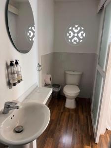 a bathroom with a white sink and a toilet at Marine Beach Hotel in Cartagena de Indias