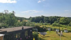 a garden with a pavilion and a bench in the grass at Tippelsberg in Bochum