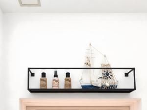 a shelf with bottles of alcohol on a wall at Apartment 202 in Bernau bei Berlin +10 photos