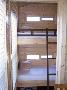 a sauna with two bunk beds in a cabin at Snowflower Camping Resort Cottage 7 in Emigrant Gap