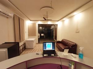 a laptop sitting on a counter in a room at Hotel Vishal in Buxar