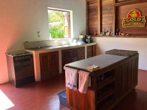 a kitchen with a stove and a counter top at Villa Masoandro in Sainte Marie +20 photos