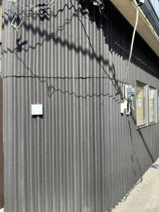 a side of a building with a building at HOTEl MOTO in Oshima