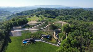 an aerial view of a farm in the woods at Ville Pačetina in Lepajci