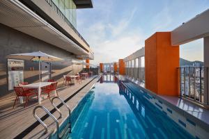 a swimming pool on the roof of a building at Hotel HLB in Busan