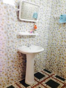 a bathroom with a white sink and a mirror at MAIYOK in Ko Si Chang +43 photos