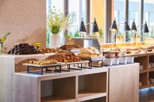 a buffet line with bread and pastries on display at Hotel HLB in Busan