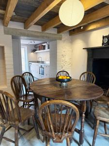 a dining room with a wooden table and chairs at The Old Manse, Horton in Horton