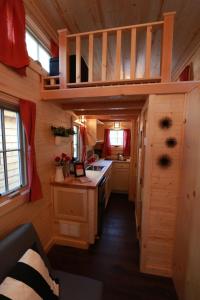 a tiny house with a kitchen and a loft at Verde Valley Tiny House 18 in Cottonwood
