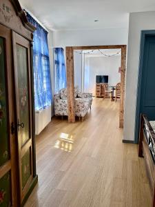 a living room with a couch and a table at Art Residence Goldener Löwe in Bodman-Ludwigshafen