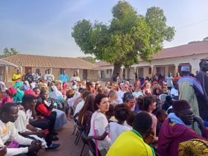 a large group of people sitting in a crowd at SEN-CASA- TOURiSME in Kabadio