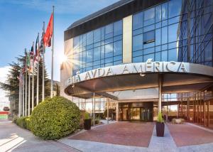 a building with a sign that reads the apa america at Meliá Avenida América in Madrid