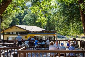 a group of people sitting in front of a food truck at Russian River Camping Resort Cottage 9 in Cloverdale