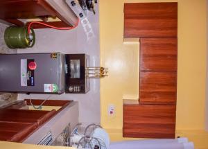 a kitchen with a sink and a coffee maker at Lucci suites in Kisumu
