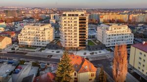 an aerial view of a city with tall buildings at Apartmán v komplexu Meridiem in Komárov +13 photos