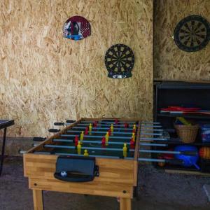 a wooden table with a chess game on it at Vár-Lak Nagymaros in Nagymaros