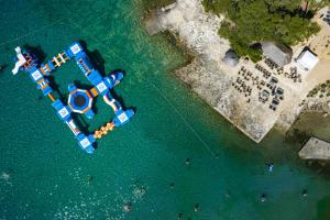 an aerial view of a resort in the water at Pine Beach Bungalows all inclusive in Pakoštane