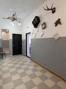 a room with a wall with books on the wall at Хостел Арабея in Vinnytsya