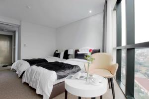 Postel nebo postele na pokoji v ubytování Eins Hotel
