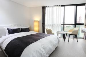 Postel nebo postele na pokoji v ubytování Eins Hotel
