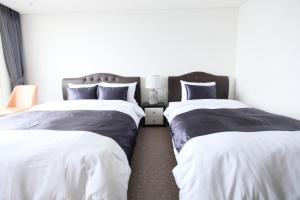 Postel nebo postele na pokoji v ubytování Eins Hotel