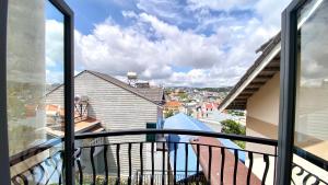 a balcony with a view of a city at Hoanglee Villa in Da Thanh
