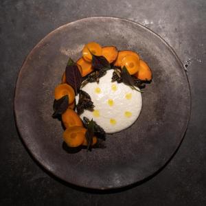 a plate of food with oranges on a table at Casona los Cedros in Espita