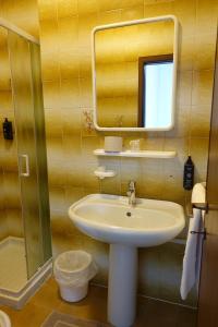a bathroom with a sink and a mirror at Hotel Nemo in Misano Adriatico +37 photos