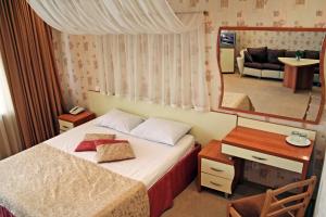 
Кровать или кровати в номере Парадиз Отель
