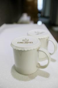 Postel nebo postele na pokoji v ubytování Eins Hotel